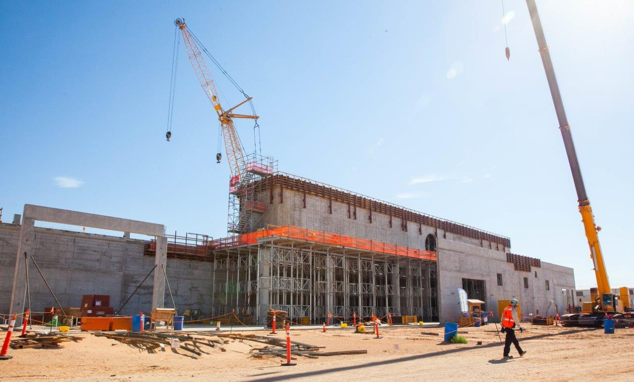 A worker walks past the New Filter Building